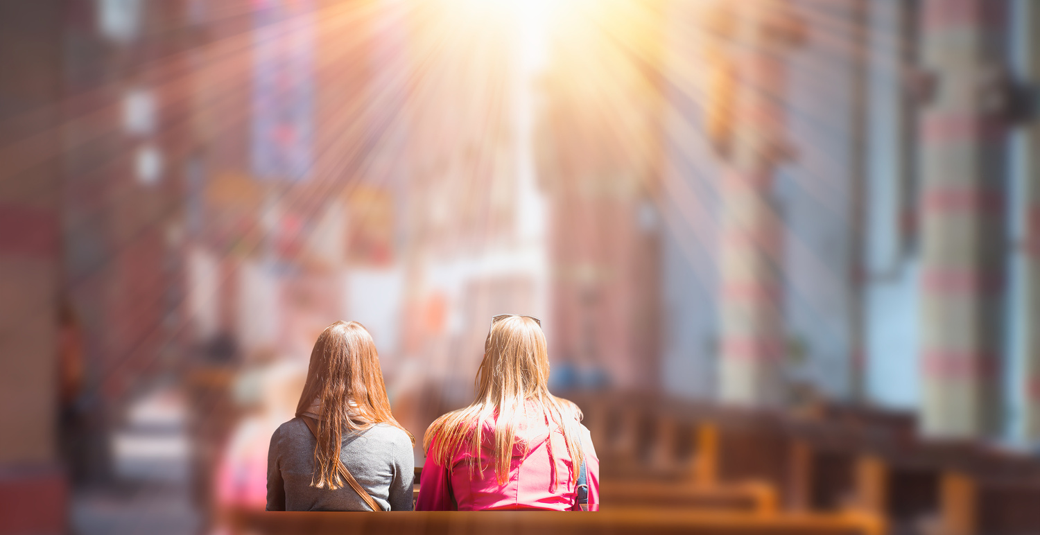 People praying in a church - Blurred photo inside of a church / Murat Erhan Okcu