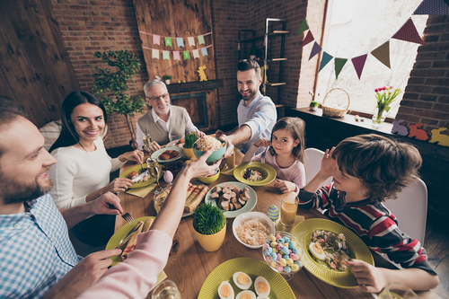 Nice sweet adorable cheerful family small little brother sister enjoying event party tasting food indoors sharing good morning day in decorated loft industrial interior room