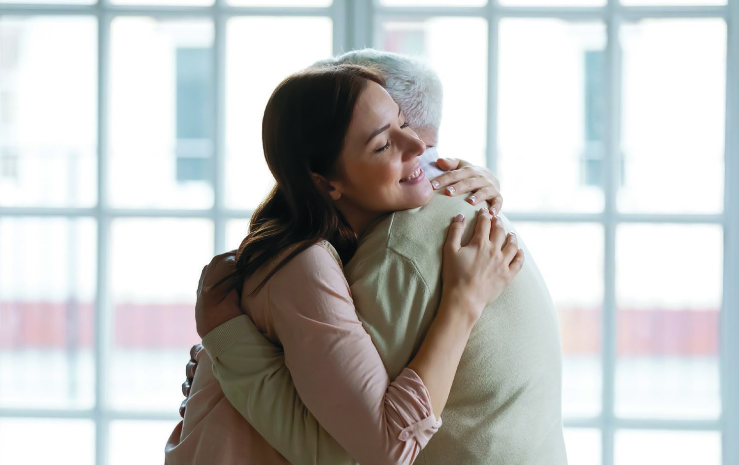 Grownup,Daughter,Straining,To,Heart,Dear,Senior,Dad,Meeting,After / Copyright (c) 2022 fizkes/Shutterstock. No use without permission., fizkes Grownup daughter straining to heart dear senior dad meeting after long time separation. Tender young woman adult grandkid cuddling with warmth elderly man grandfather greeting with birthday father day